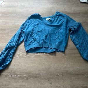 blue cropped LA hearts sweater, its kinda supposed to be oversized